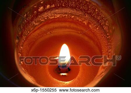 A Pumpkin Spice scented candle burning View Large Photo Image Stock Photography - A Pumpkin Spice scented candle burning. Fotosearch