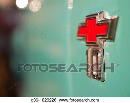 Stock Photograph - A red Chevrolet detail embellishes the turquiose exterior of a vintage car in Santa Barbara, California, United States. Fotosearch