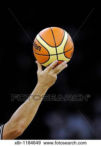 A referee holds a Molten ball during a friendly basketball tour ahead the Beijing 2008 Olympics at the Venetian Macao Resort-Hotel Casino in Macau, China View Large Photo Image Stock Photo - A referee holds a Molten ball during a friendly basketball tour ahead the Beijing 2008 Olympics at the Venetian Macao Resort-Hotel Casino in Macau, China. Fotosearch