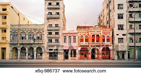A renovated building amongst other dilapidated buildings on the Malecon in Havana, Cuba View Large Photo Image Stock Photo - A renovated building amongst other dilapidated buildings on the Malecon in Havana, Cuba. Fotosearch