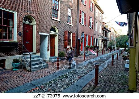 A resident walks through Elfreth's Alley, the oldest, continuously occupied neighborhood in the original United States. View Large Photo Image Stock Photography - A resident walks through Elfreth's Alley, the oldest, continuously occupied neighborhood in the original United States.. Fotosearch