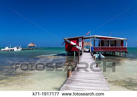 Stock Photo - A restaurant on the pier on the island of Cay Caulker, Belize. Fotosearch
