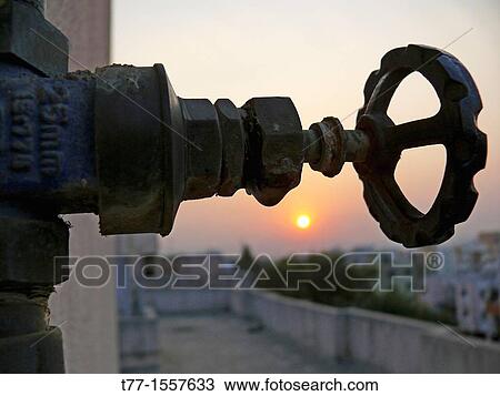 A revolving cock, water pipeline going to overhead water storage on a building terrace View Large Photo Image Stock Image - A revolving cock, water pipeline going to overhead water storage on a building terrace. Fotosearch