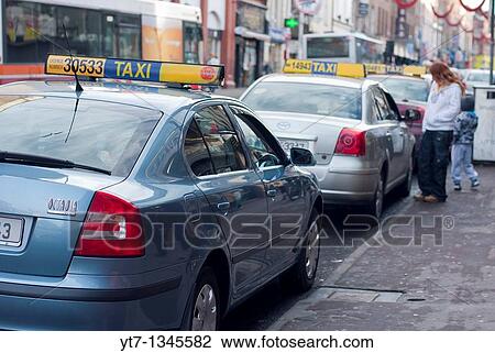 A row of taxi cabs on William Street in Limerick city, Republic of Ireland View Large Photo Image Stock Image - A row of taxi cabs on William Street in Limerick city, Republic of Ireland. Fotosearch