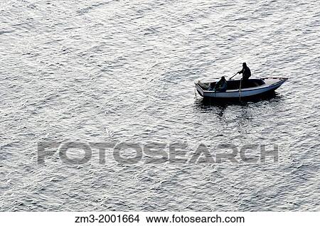 A rowing boat in the Titikaka Lake, Peru View Large Photo Image Picture - A rowing boat in the Titikaka Lake, Peru. Fotosearch