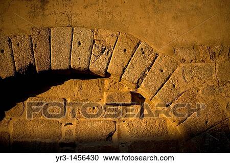 Stock Image - A sealed door among the ruins of the Islamic fortress called Alcazaba in Mrida, Badajoz province, Extremadura region, Spain.. Fotosearch