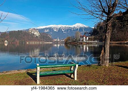 A seat overlooking Bled Castle and the Pilgrimage Church of the Assumption of Mary on Bled Island Lake Bled Slovenia. View Large Photo Image Stock Photography - A seat overlooking Bled Castle and the Pilgrimage Church of the Assumption of Mary on Bled Island Lake Bled Slovenia.. Fotosearch