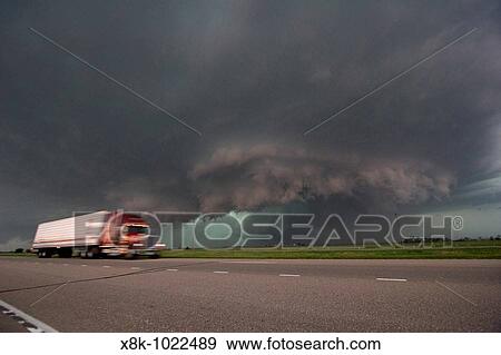 Stock Photo - A semi pases a tornadic supercell just east of Kearney, Nebraska on Interstate 80, May 29, 2008 Shot from exit of interstate 80. Fotosearch