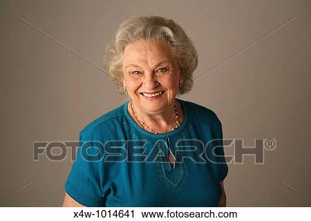 Stock Image - A senior citizen woman poses for a portrait. Fotosearch