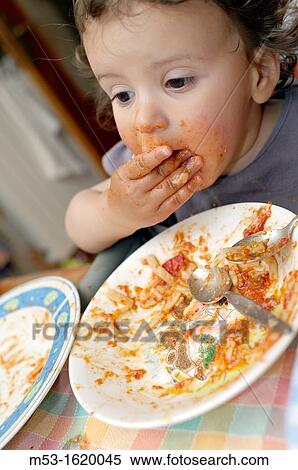 A seventeen months old baby girl eat tomato sauce paste with her hands Selective focus on the mouth View Large Photo Image Stock Photography - A seventeen months old baby girl eat tomato sauce paste with her hands Selective focus on the mouth. Fotosearch
