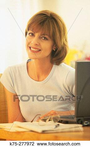 A short break from her office work View Large Photo Image Stock Image - A short break from her office work. Fotosearch