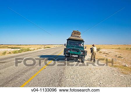 A single car on a tar road in Botswana, Africa View Large Photo Image Stock Photograph - A single car on a tar road in Botswana, Africa. Fotosearch