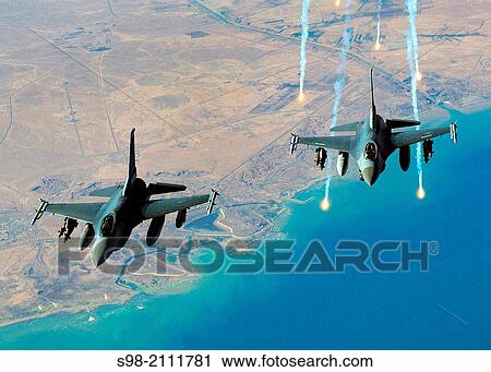A single US Air Force (USAF) F-16C Fighting Falcon aircraft from the 332nd Air Expeditionary Wing, Balad AB, Iraq, flying in a two man formation View Large Photo Image Stock Image - A single US Air Force (USAF) F-16C Fighting Falcon aircraft from the 332nd Air Expeditionary Wing, Balad AB, Iraq, flying in a two man formation. Fotosearch