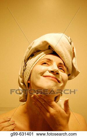 A single woman of a certain age prepares for an evening out in a large Canadian city during the middle of the winter. View Large Photo Image Stock Image - A single woman of a certain age prepares for an evening out in a large Canadian city during the middle of the winter.. Fotosearch
