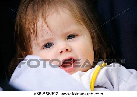 Stock Image - A six month old baby has many facial expressions.. Fotosearch
