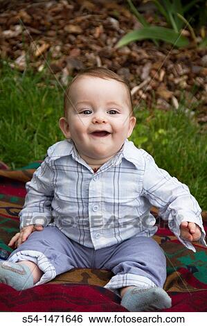 Stock Photograph - A six-month-old caucasian baby boy laughing.. Fotosearch