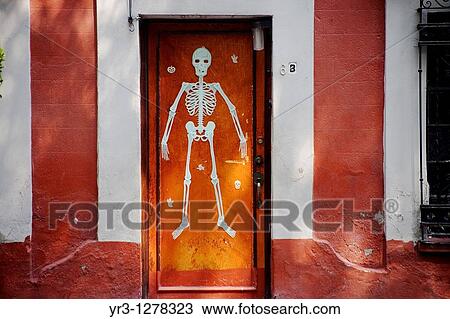 A skeleton decorates a home's door in Coyoacan ahead of Day of the Dead celebrations, Mexico City. View Large Photo Image Stock Image - A skeleton decorates a home's door in Coyoacan ahead of Day of the Dead celebrations, Mexico City.. Fotosearch