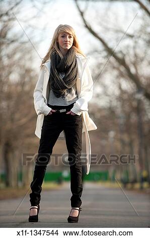 A slim blonde 14 year old teenage girl outdoors day UK View Large Photo Image Picture - A slim blonde 14 year old teenage girl outdoors day UK. Fotosearch
