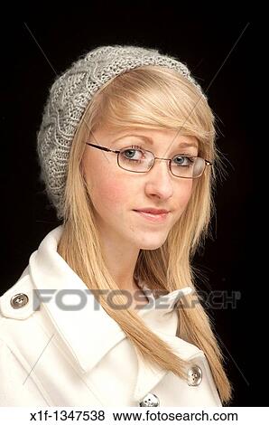 A slim blonde short-sighted 14 year old teenage girl wearing glasses, UK View Large Photo Image Stock Photo - A slim blonde short-sighted 14 year old teenage girl wearing glasses, UK. Fotosearch
