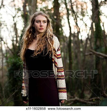 a slim blonde woman girl alone in woodland autumn afternoon daytime UK View Large Photo Image Stock Photo - a slim blonde woman girl alone in woodland autumn afternoon daytime UK. Fotosearch