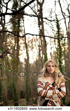 a slim blonde woman girl alone in woodland autumn afternoon daytime UK View Large Photo Image Stock Photo - a slim blonde woman girl alone in woodland autumn afternoon daytime UK. Fotosearch