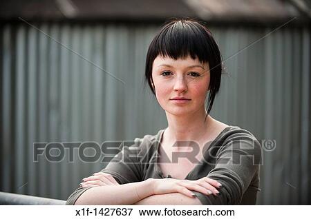 a slim teenage 18, 19, 20 years old girl with short dark hair View Large Photo Image Stock Photo - a slim teenage 18, 19, 20 years old girl with short dark hair. Fotosearch