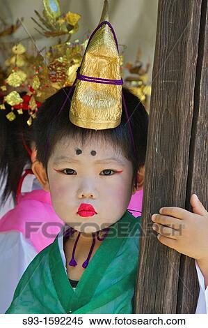 A small costumed boy with make-up, taking part in a temple celebration View Large Photo Image Stock Photography - A small costumed boy with make-up, taking part in a temple celebration. Fotosearch