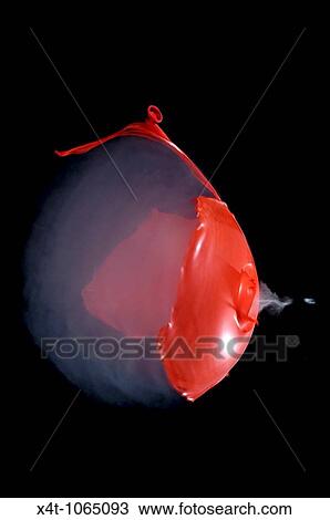 A smoke filled red balloon bursting when shot with an air rifle Sound wave visible and pellet exiting View Large Photo Image Stock Image - A smoke filled red balloon bursting when shot with an air rifle Sound wave visible and pellet exiting. Fotosearch