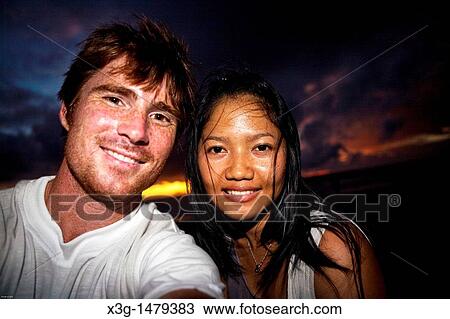 Stock Image - A spectacluar yet common sunset at Kuta Beach, Bali, Indonesia. Fotosearch