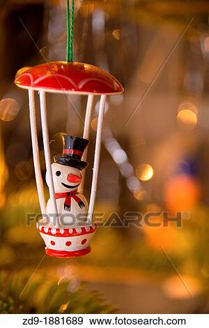 A spritely snowman in a parachute is a jolly holiday tree ornament View Large Photo Image Stock Photo - A spritely snowman in a parachute is a jolly holiday tree ornament. Fotosearch