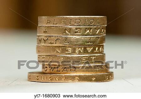 A stack of one pound coins sitting on a two pound coin View Large Photo Image Stock Image - A stack of one pound coins sitting on a two pound coin. Fotosearch