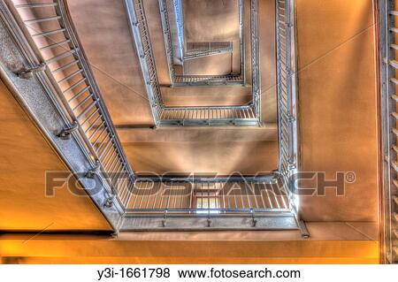 Stock Photo - A stairway inside the Ellis Island Immigration Museum. The Museum is part of the Statue of Liberty National Monument.. Fotosearch