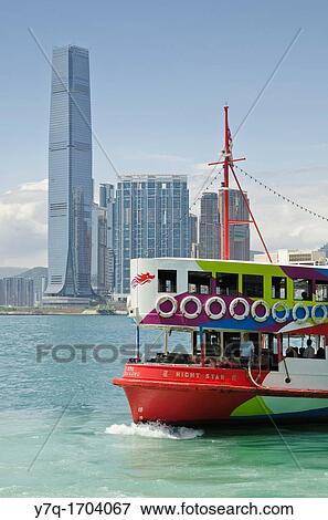 A Star Ferry in Victoria Harbour with the Hong Kong waterfront development of Union Square in the background, Hong Kong, China View Large Photo Image Stock Photo - A Star Ferry in Victoria Harbour with the Hong Kong waterfront development of Union Square in the background, Hong Kong, China. Fotosearch