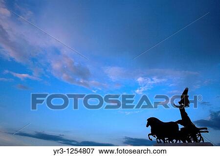 Stock Photo - A statue of a Quadriga, or charriot, at the National Monument of Victor Emmanuel II in Rome. Fotosearch