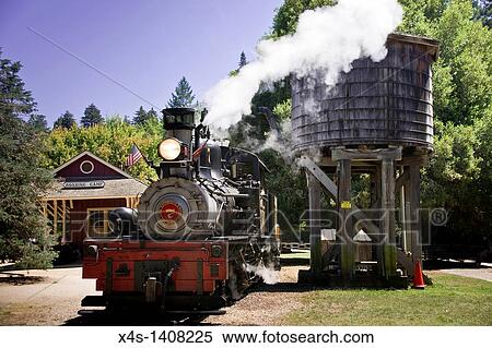 A steam train arrives at Roaring Camp depot View Large Photo Image Stock Photography - A steam train arrives at Roaring Camp depot. Fotosearch