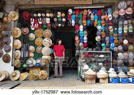 A street vendor selling a variety of modern and traditional hats View Large Photo Image Stock Photo - A street vendor selling a variety of modern and traditional hats. Fotosearch
