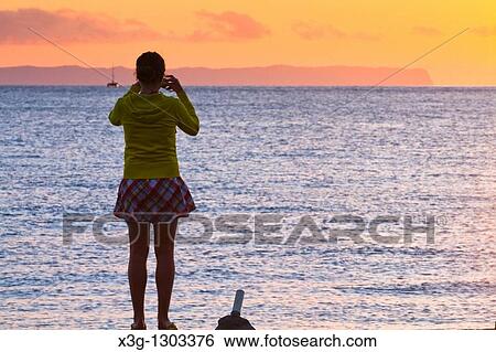 A sunset reveals the island of Niihau in background, images along the open coastal region of Waimea and the western side of Kauai, Hawaii, USA View Large Photo Image Stock Photograph - A sunset reveals the island of Niihau in background, images along the open coastal region of Waimea and the western side of Kauai, Hawaii, USA. Fotosearch