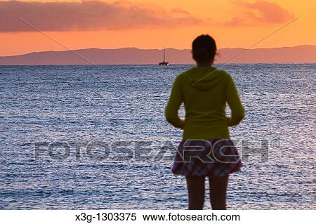 A sunset reveals the island of Niihau in background, images along the open coastal region of Waimea and the western side of Kauai, Hawaii, USA View Large Photo Image Stock Photography - A sunset reveals the island of Niihau in background, images along the open coastal region of Waimea and the western side of Kauai, Hawaii, USA. Fotosearch