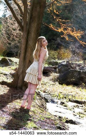 A teen girl outdoors View Large Photo Image Stock Image - A teen girl outdoors. Fotosearch