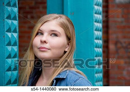 A teen girl outdoors View Large Photo Image Stock Image - A teen girl outdoors. Fotosearch