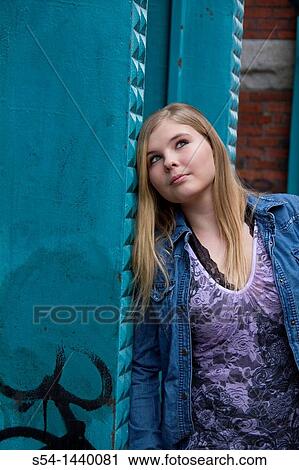 A teen girl outdoors View Large Photo Image Stock Image - A teen girl outdoors. Fotosearch