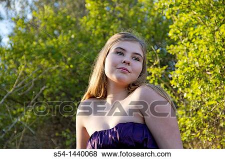 A teen girl outdoors View Large Photo Image Stock Photo - A teen girl outdoors. Fotosearch