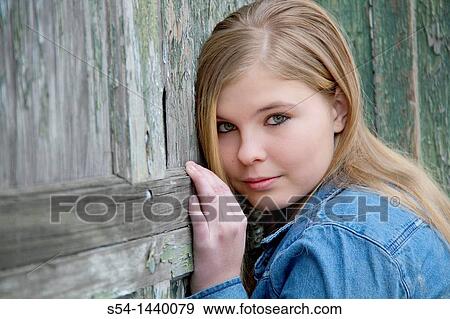 A teen girl outdoors View Large Photo Image Stock Photo - A teen girl outdoors. Fotosearch