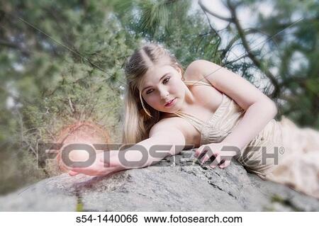 Stock Photograph - A teen girl outdoors. Fotosearch