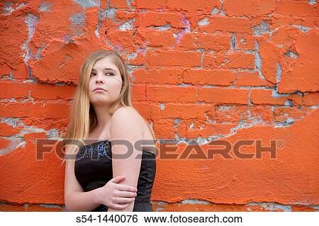 Stock Photograph - A teen girl outdoors. Fotosearch