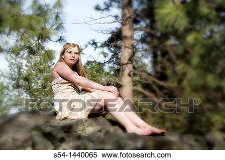 A teen girl outdoors View Large Photo Image Stock Photography - A teen girl outdoors. Fotosearch
