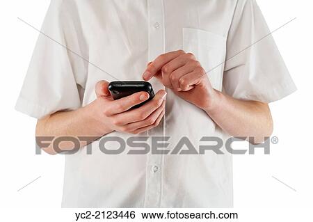 A teenage boy texting on a smartphone. View Large Photo Image Stock Photograph - A teenage boy texting on a smartphone.. Fotosearch