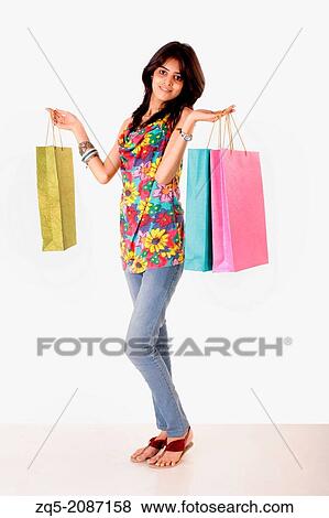 A teenaged girl with her shopping bags, Pune, India. View Large Photo Image Stock Photo - A teenaged girl with her shopping bags, Pune, India.. Fotosearch