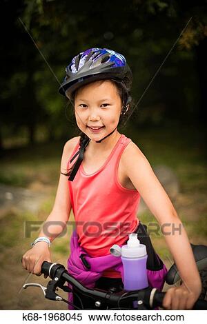 A ten year old girl with her bicycle on Saturna Island, Gulf Islands, British Columbia, Canada View Large Photo Image Stock Photography - A ten year old girl with her bicycle on Saturna Island, Gulf Islands, British Columbia, Canada. Fotosearch