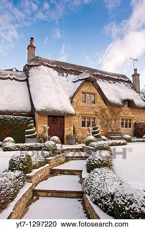 A thatched cottage covered in snow on the edge of the Cotswold village of Chipping Campden England View Large Photo Image Stock Image - A thatched cottage covered in snow on the edge of the Cotswold village of Chipping Campden England. Fotosearch